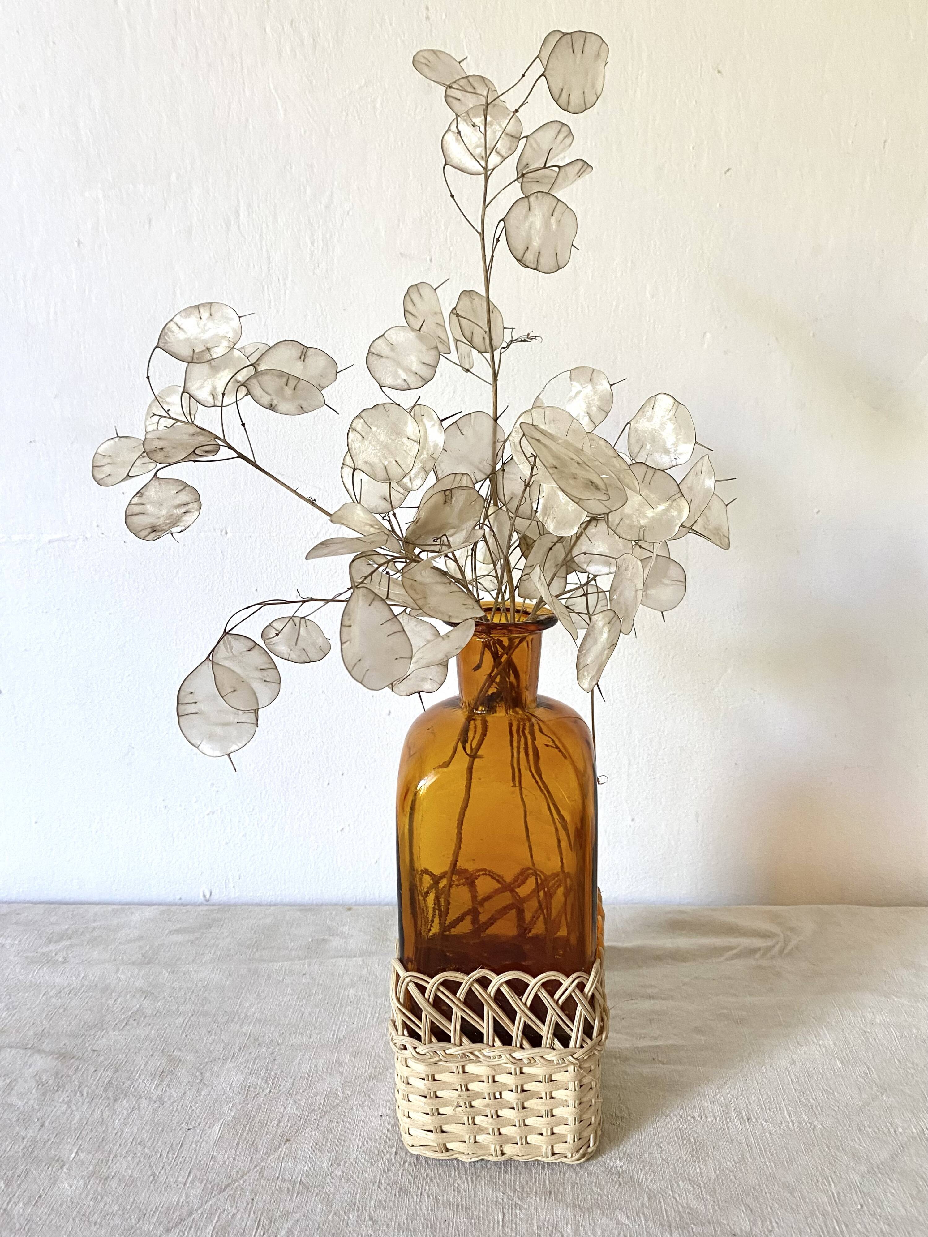 Amber glass and rattan carafe
