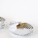 Pair of worked stainless steel shell trinket trays, 1970