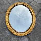Antique gilded oval mirror