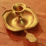 Old brass hand candle holder