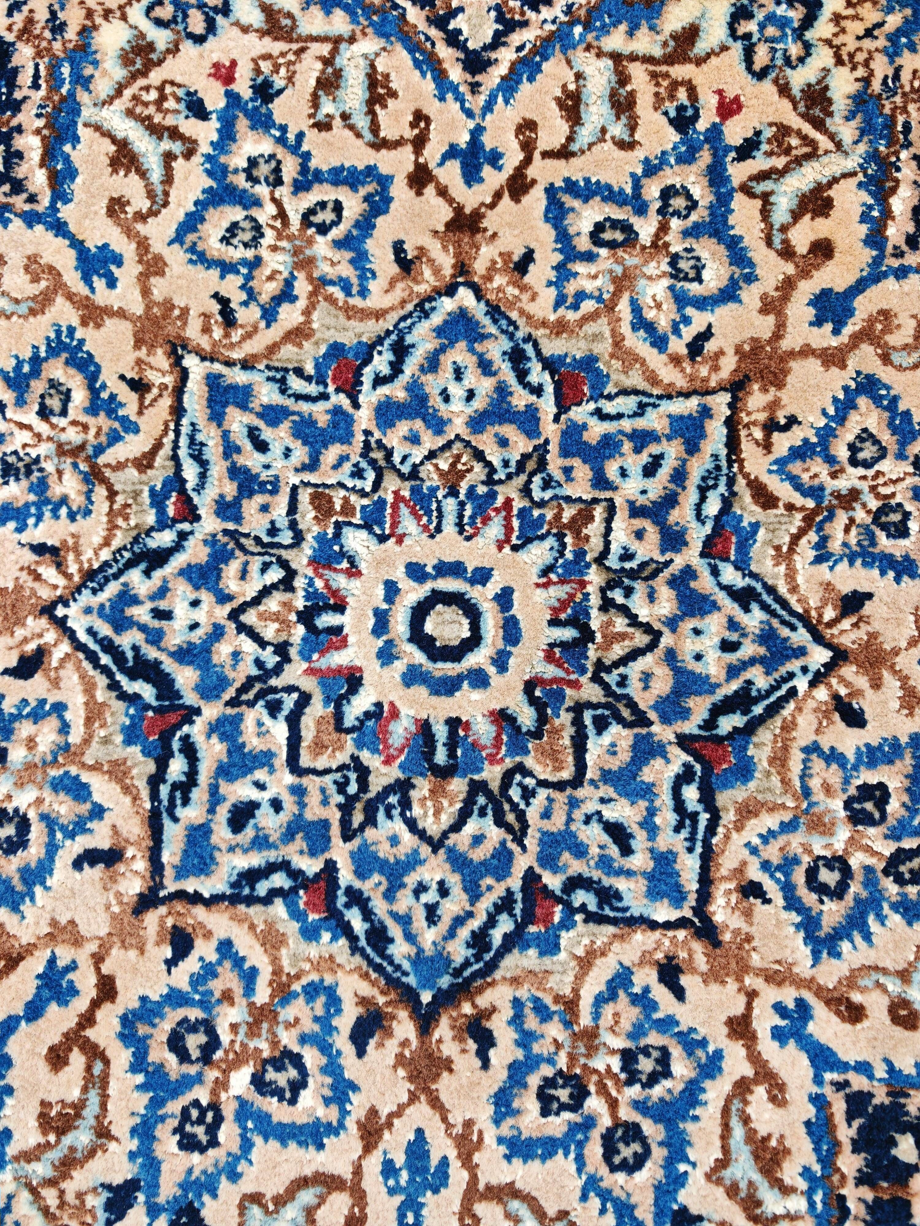Vintage Persian Nain carpet, handwoven wool and silk from the 1940s.