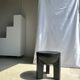 Black mango wood tripod side table with a semi-spherical top, height: 45 cm, diameter: 44 cm.