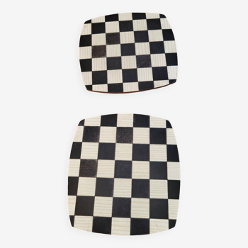 2 black and white checkerboard trivets