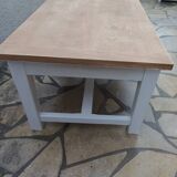Coffee table with pearl grey legs and a wooden top.