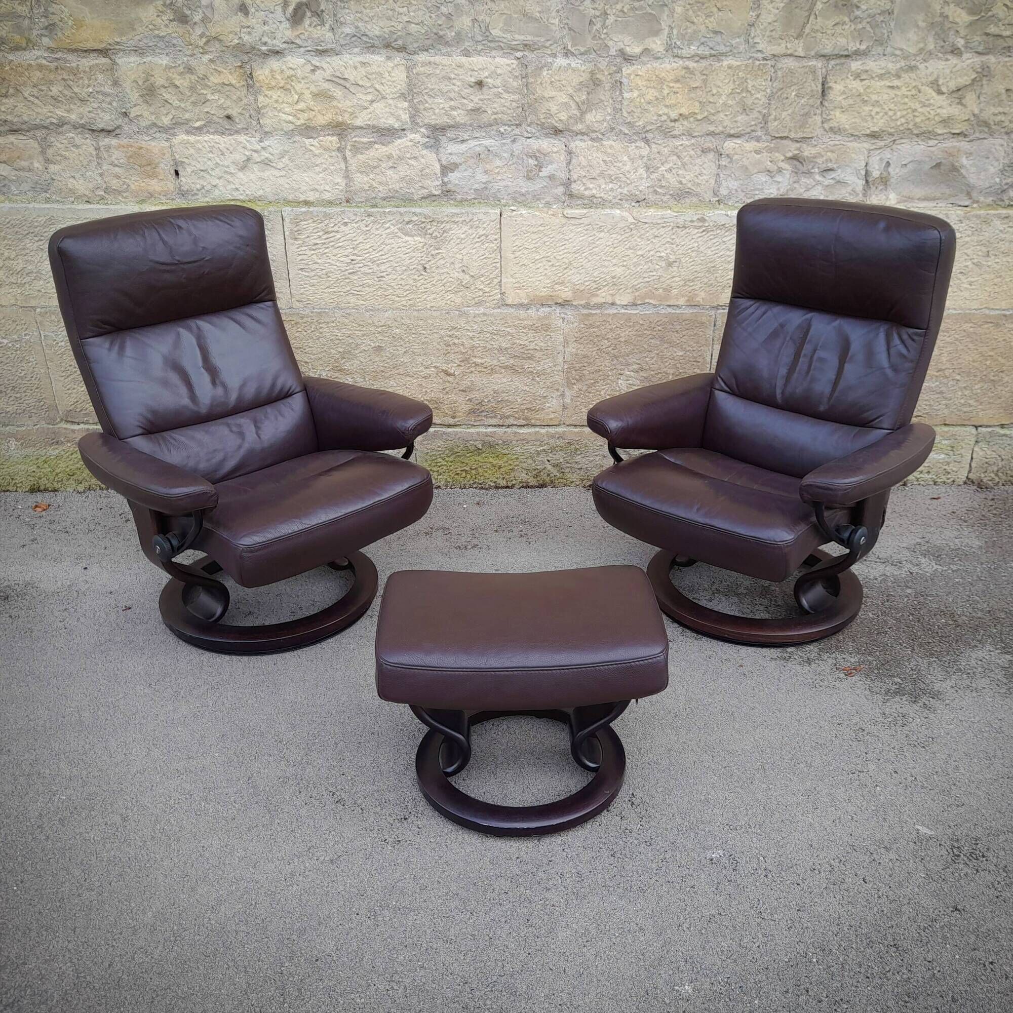 Pair of Scandinavian leather armchairs and ottoman, Ekornes, Norway, 1970