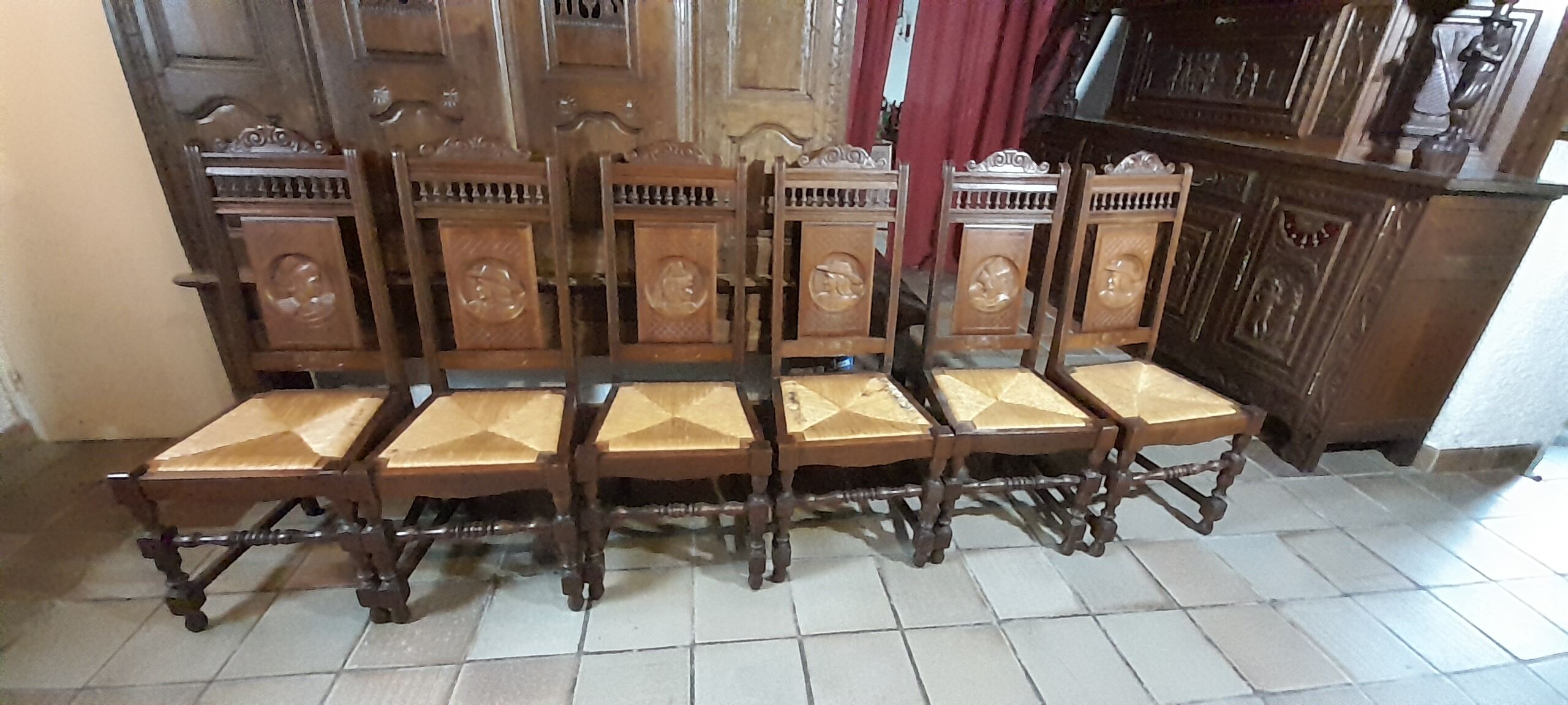 Breton dining room table with 2 extensions and 6 chairs with carved Breton characters