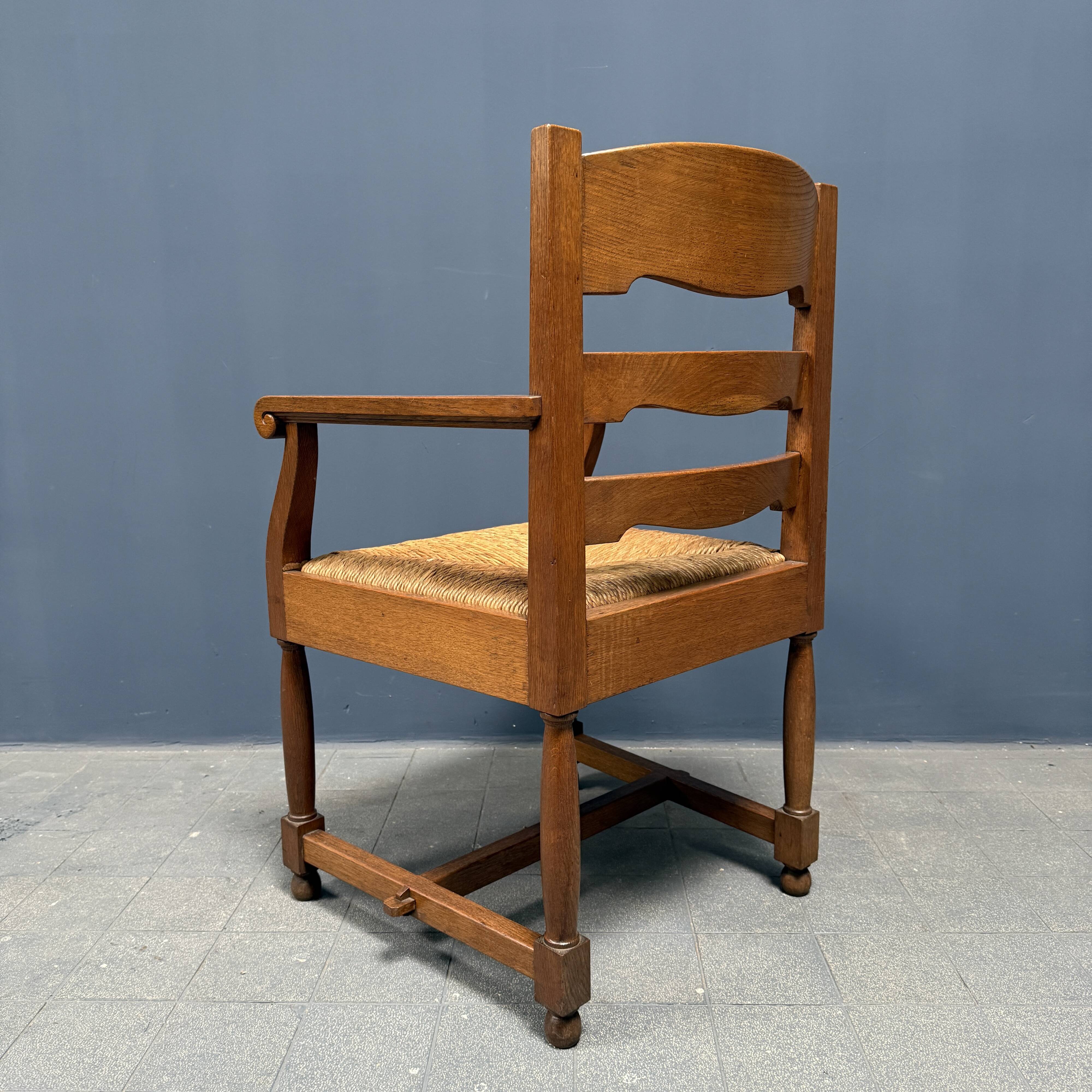 Set of two Dutch oak armchairs with rush seats
