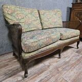 Antique English two-seater canapé, carved wooden frame.