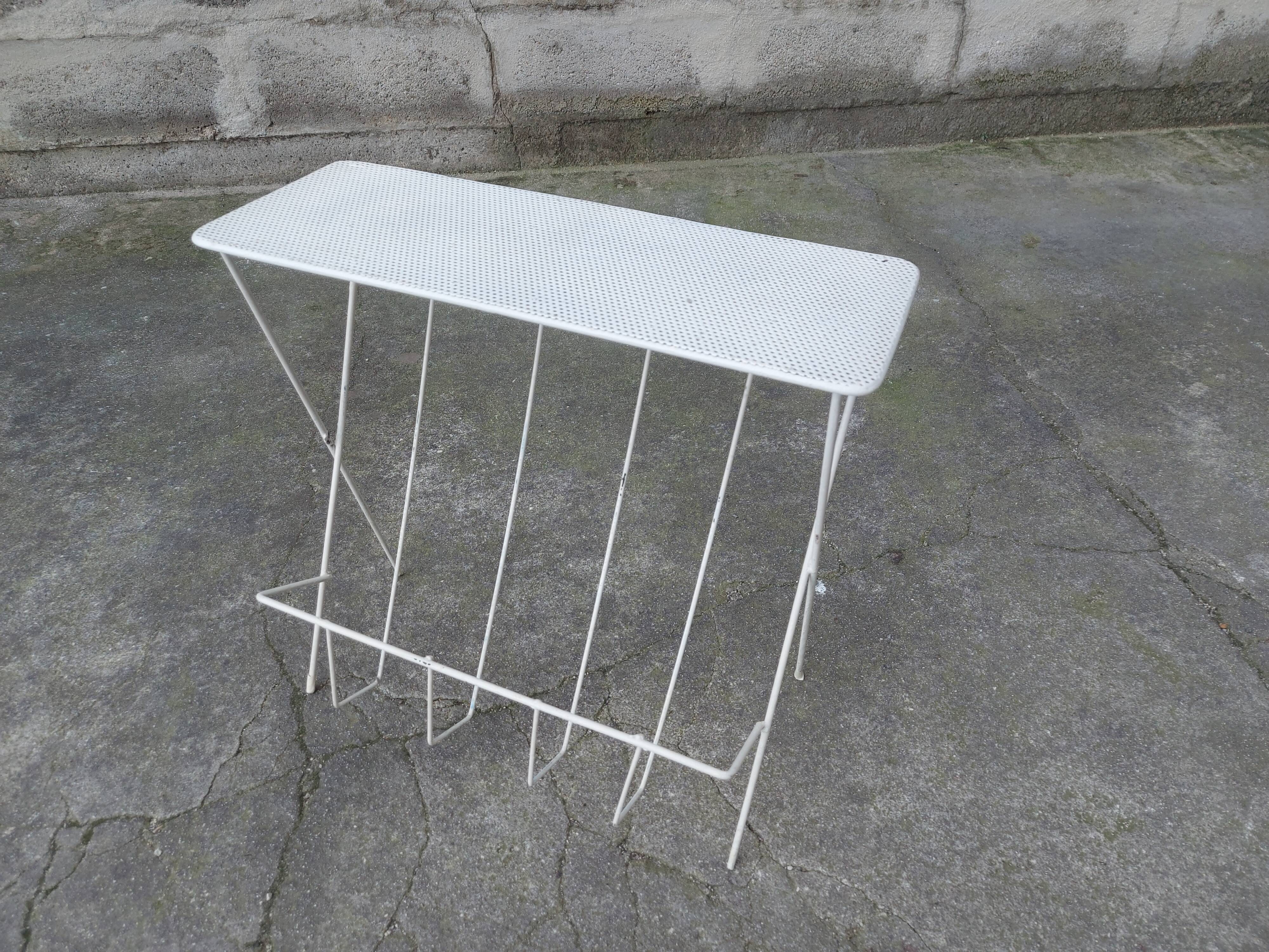 Vintage magazine holder in perforated metal