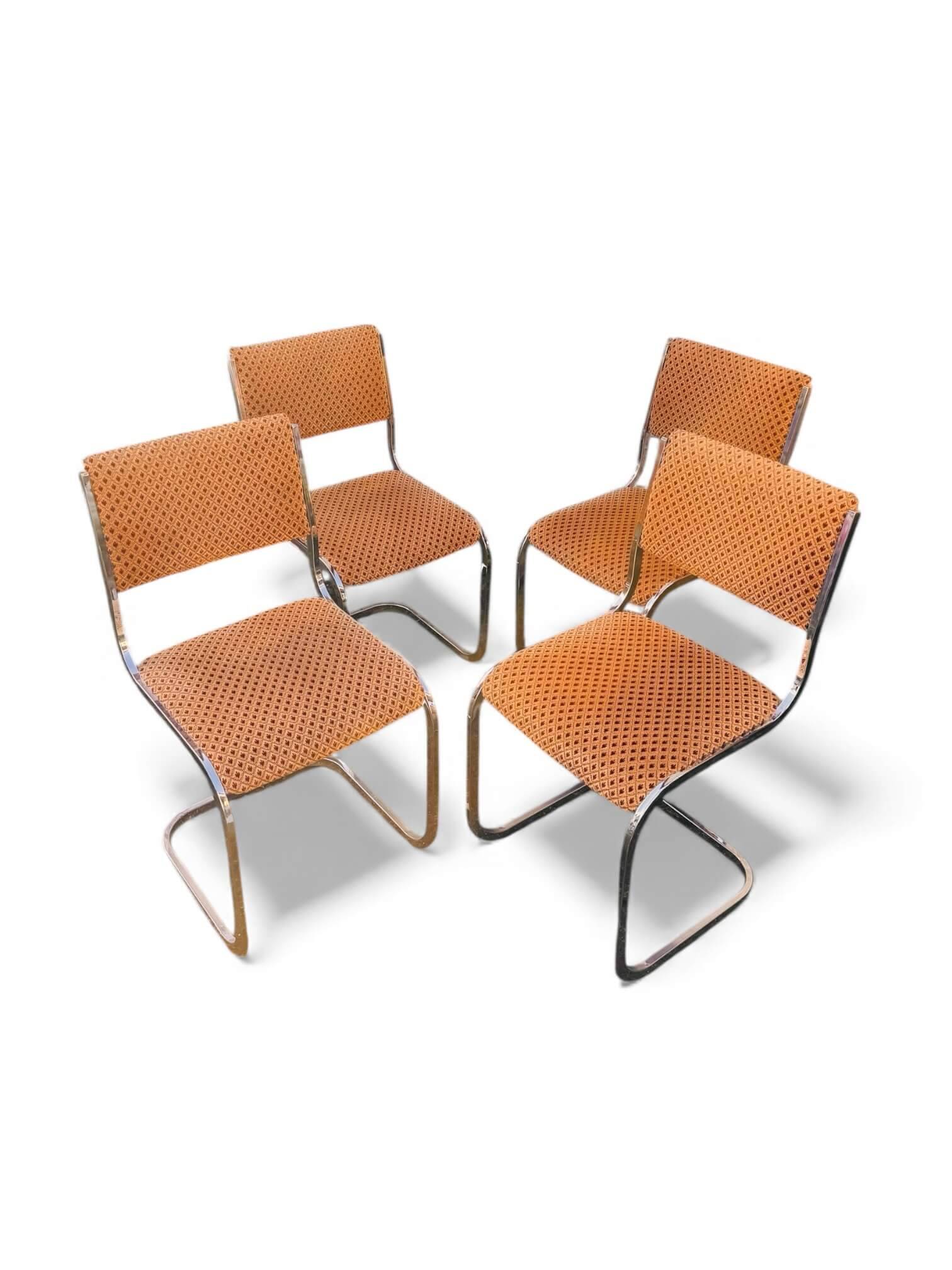 Set of 4 vintage sled chairs from the 1970s
