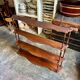 Curved and turned wooden wall shelf
