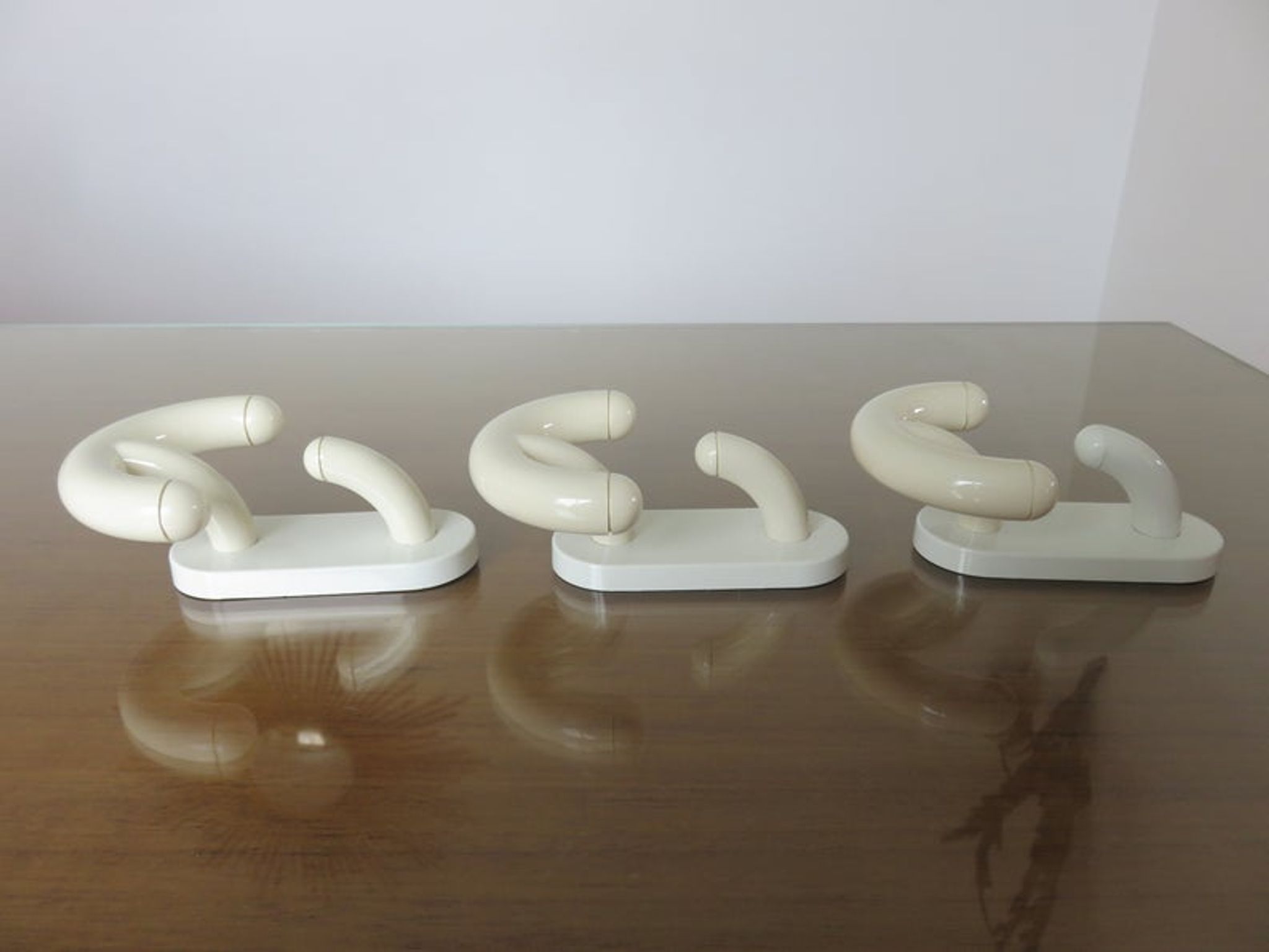 Luigi Caramella's series of 3 patères for " Con & Con " Itay era Memphis 80s