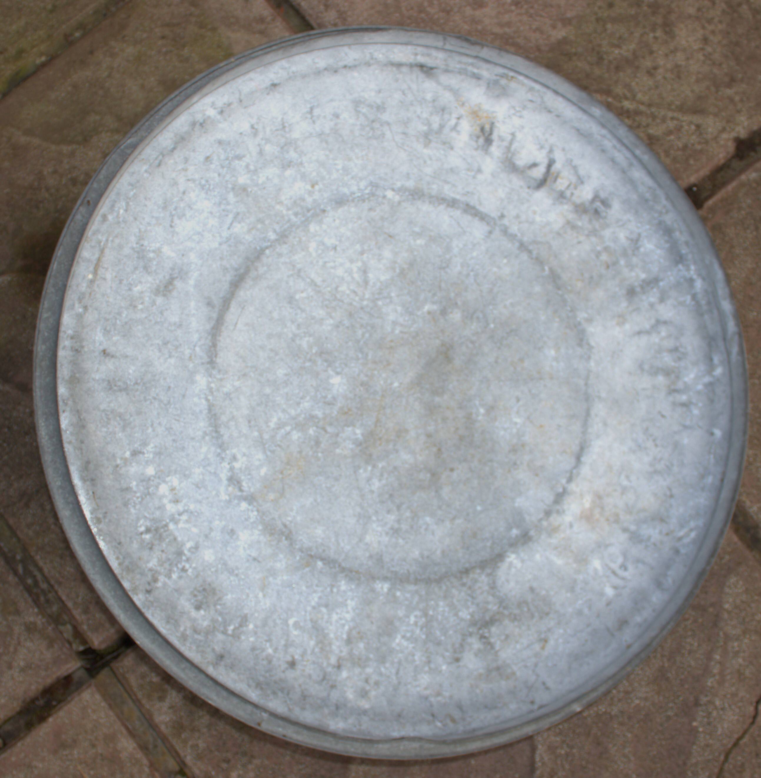 Old galvanized zinc trash can with lid