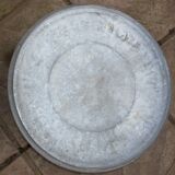 Old galvanized zinc trash can with lid