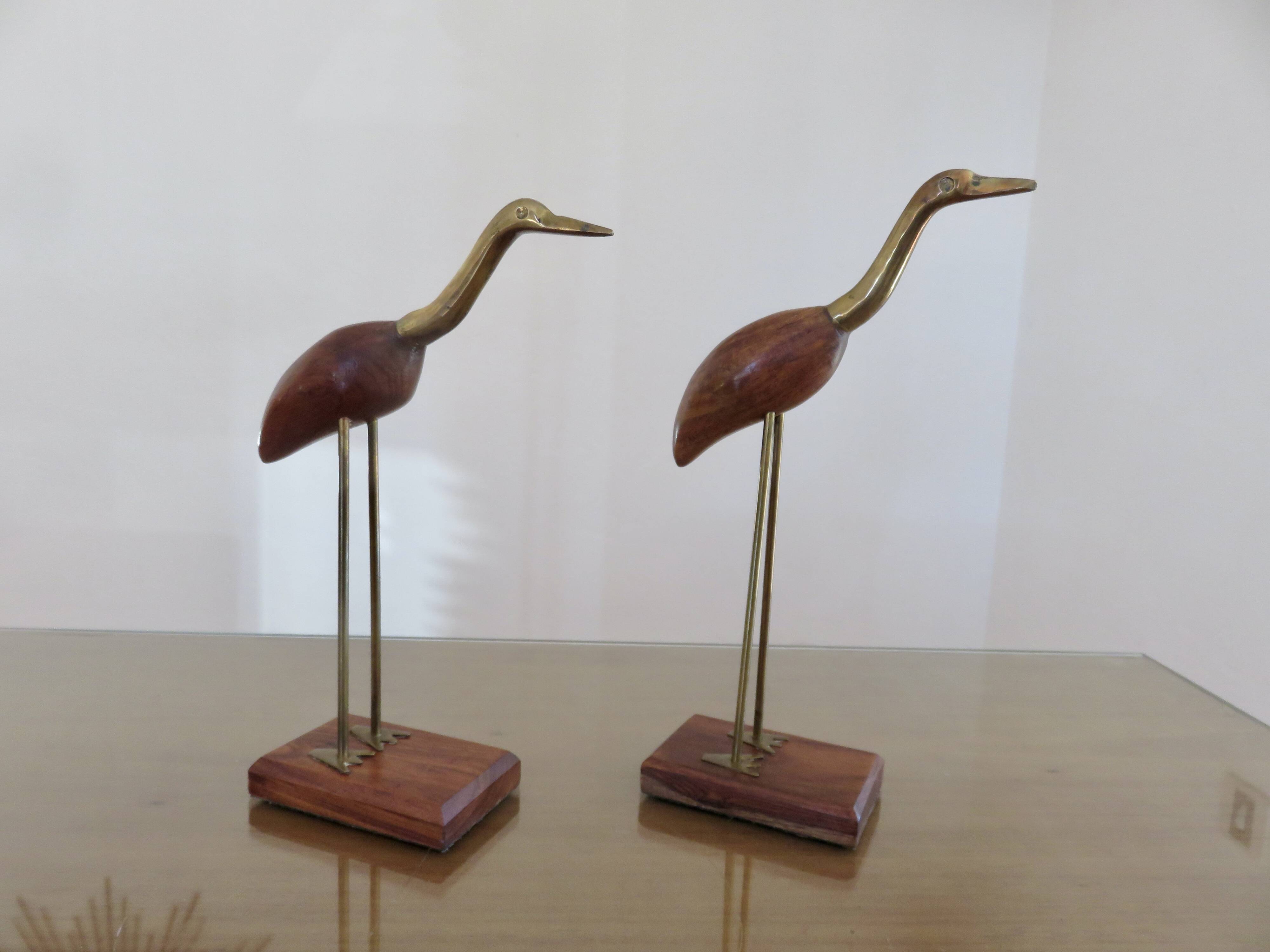 Pair of teak and brass herons from the 70s