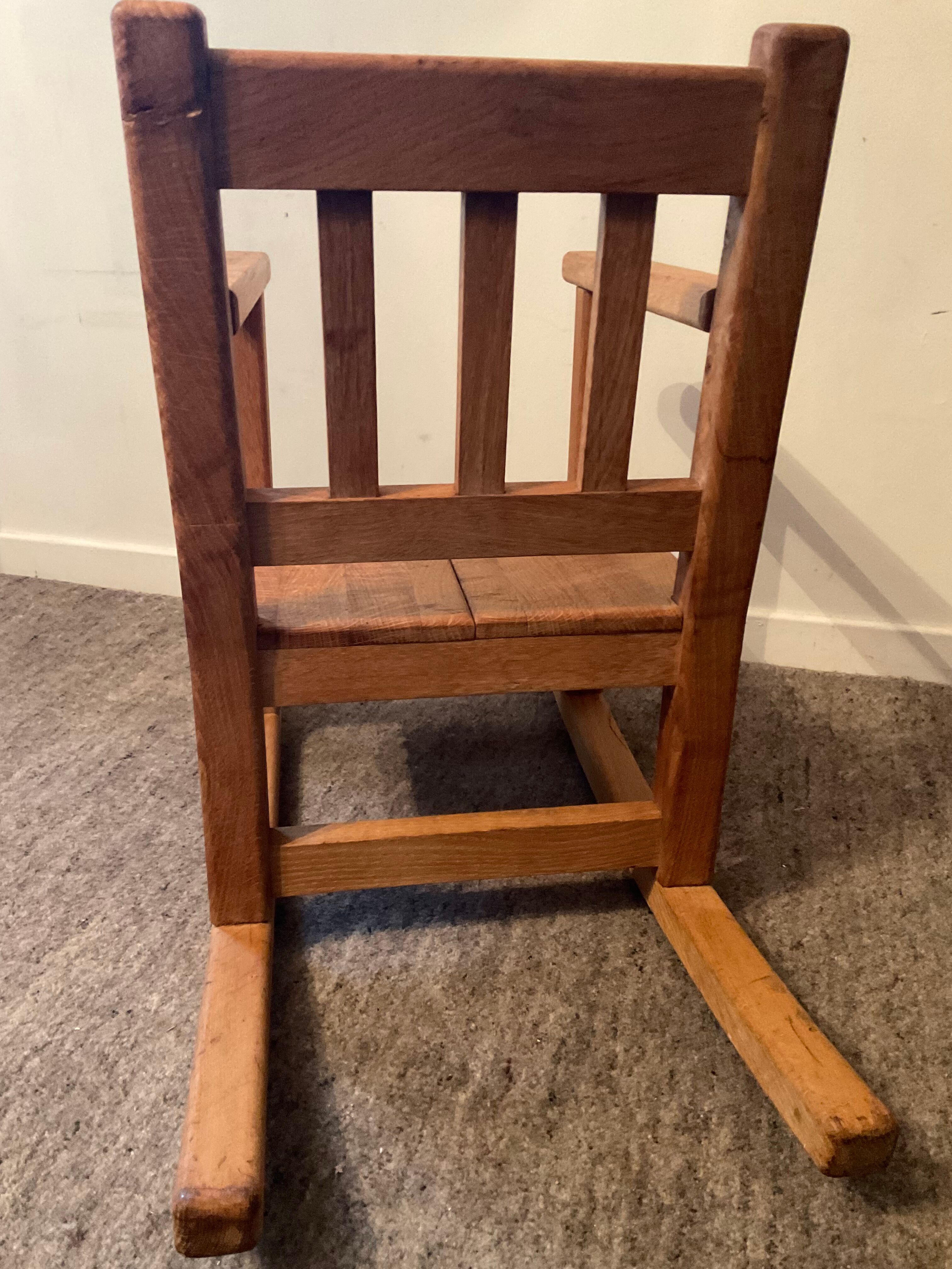Old children's rocking chair in solid wood