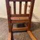 Old children's rocking chair in solid wood