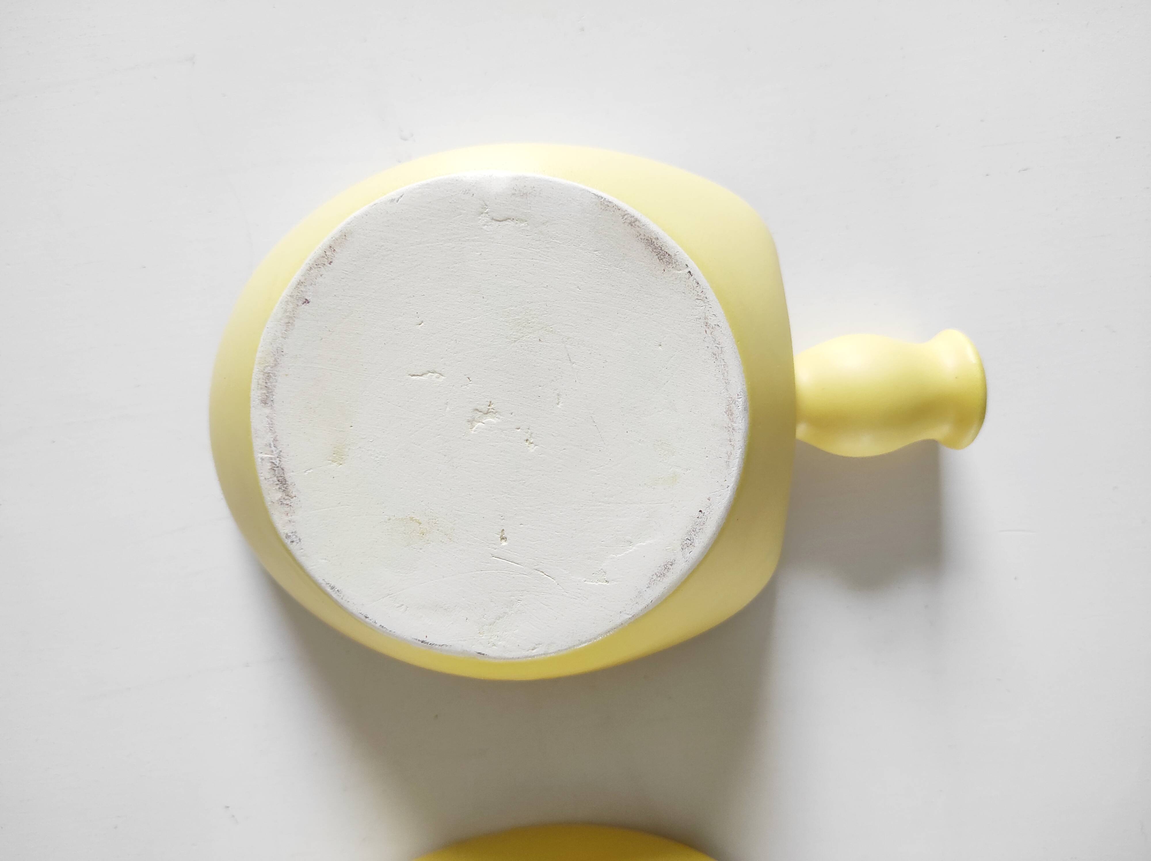 Two yellow ceramic dishes