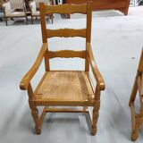 Two oak armchairs with straw seats
