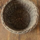 Round wicker basket with a patina