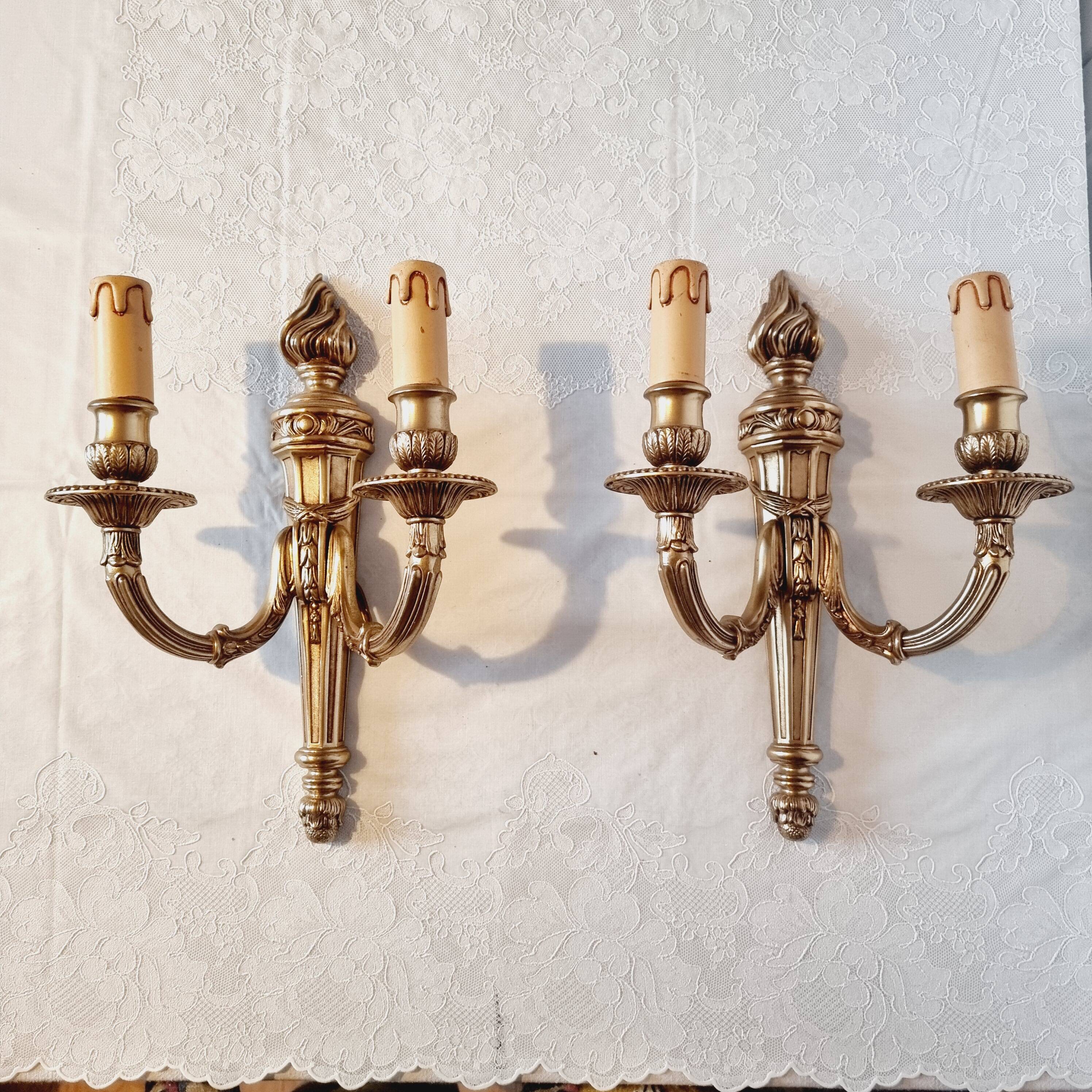 Pair of Louis XV style rocaille two-armed sconces in gilded bronze