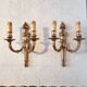 Pair of Louis XV style rocaille two-armed sconces in gilded bronze