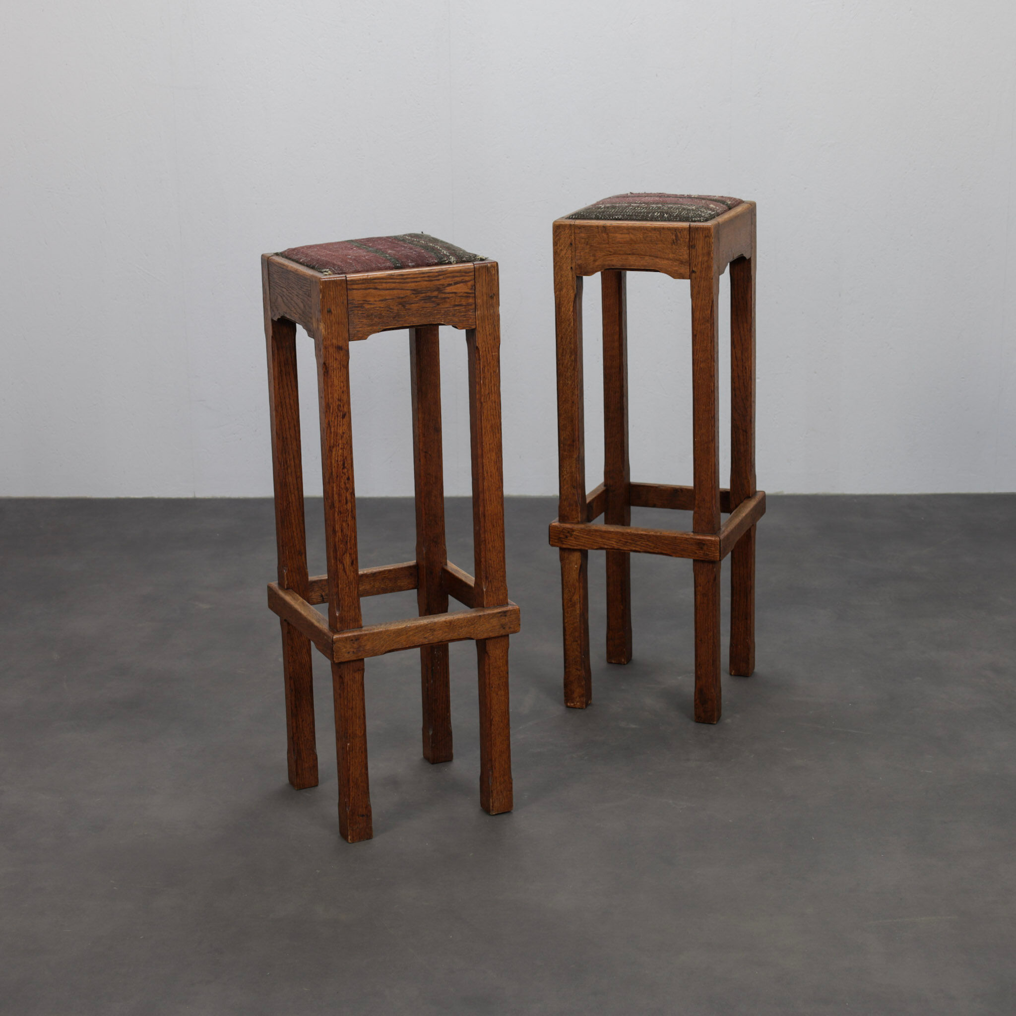Pair of Dutch Art Deco oak bar stools with upholstered seats, 1930s