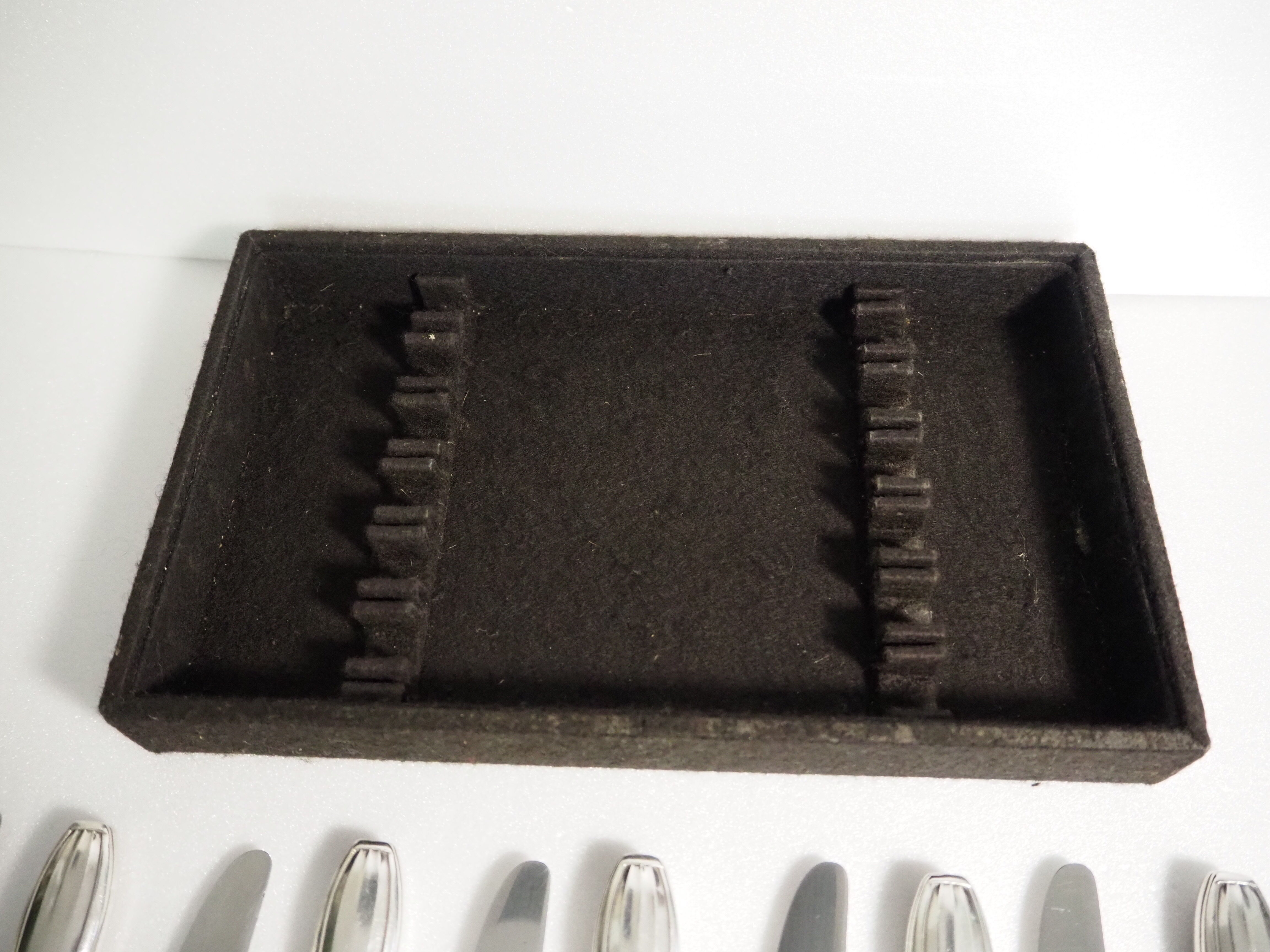 12 SFAM cheese knives in its dark chocolate case