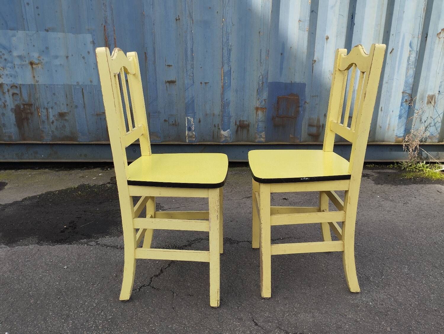 Pair of wooden and yellow formica chairs