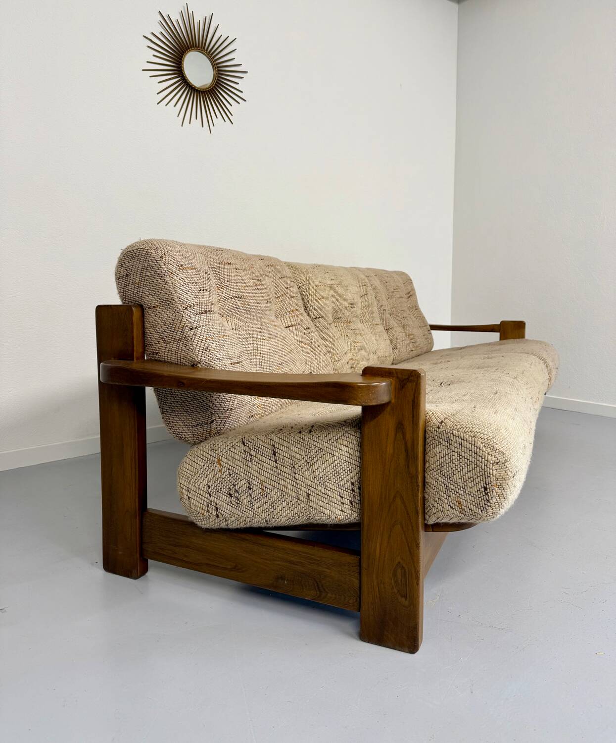 Old 3-seater sofa in solid wood, Maison Regain design, from the 70s.