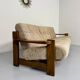 Old 3-seater sofa in solid wood, Maison Regain design, from the 70s.