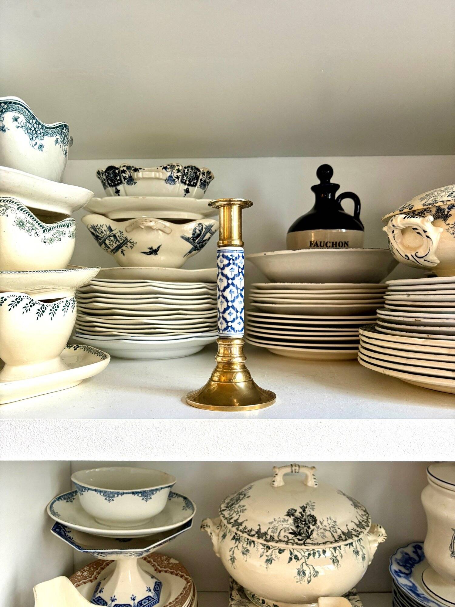 Candlestick in gilded brass and blue earthenware