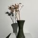 Dark green handcrafted vase with glazed ceramic grass blades