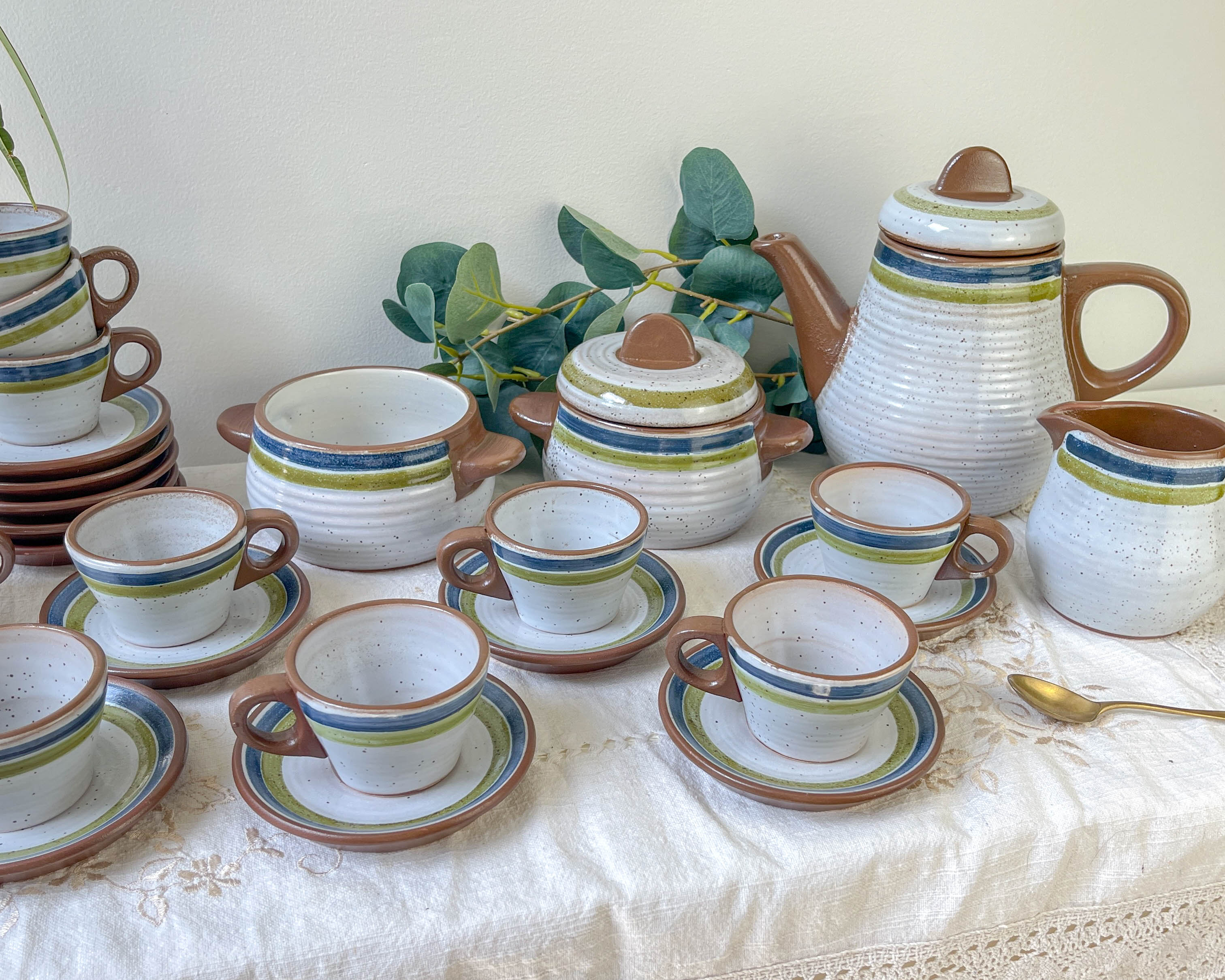 Vintage 1950s speckled stoneware coffee set with grey, green, and blue stripes