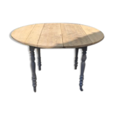 Table ronde aux cotés rabattables