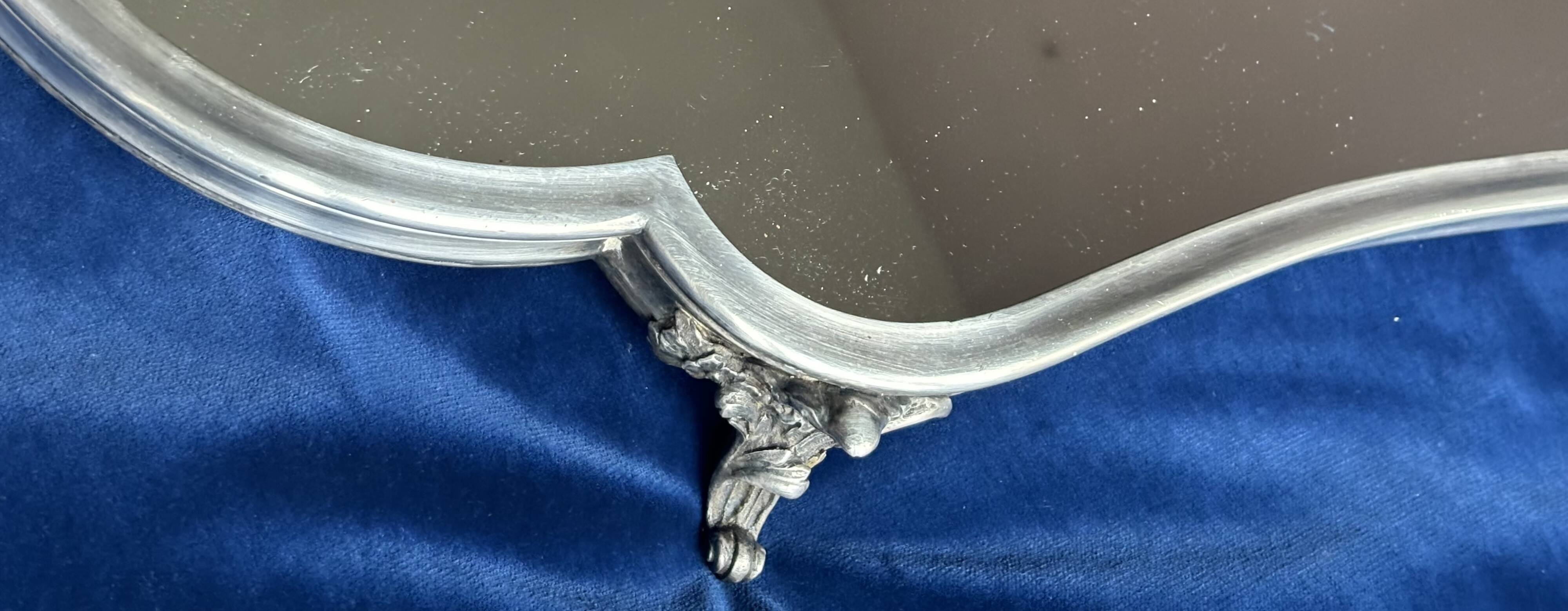 19th century mirror and silver table centrepiece