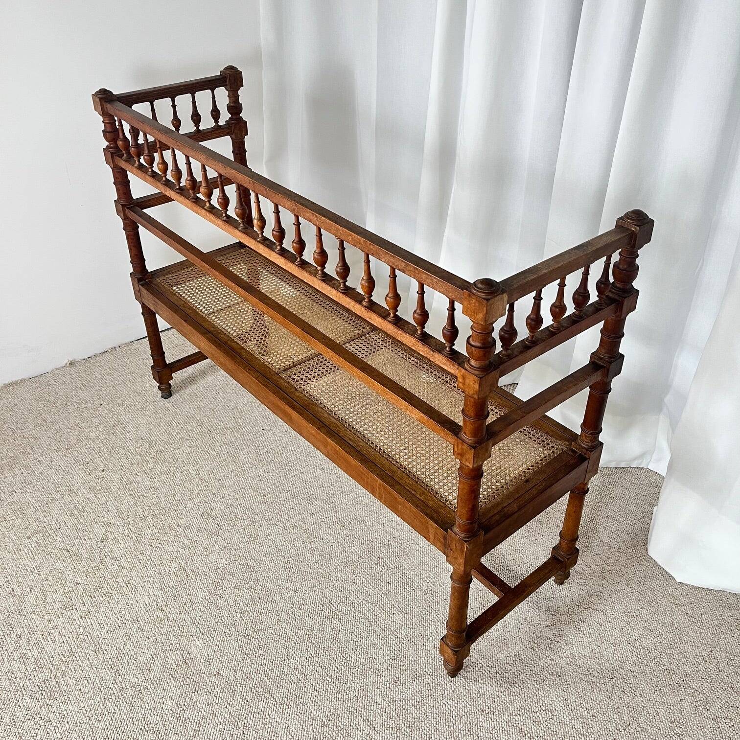 Antique banquette in Louis XIII style, turned wood with caning, late 19th to early 20th century.