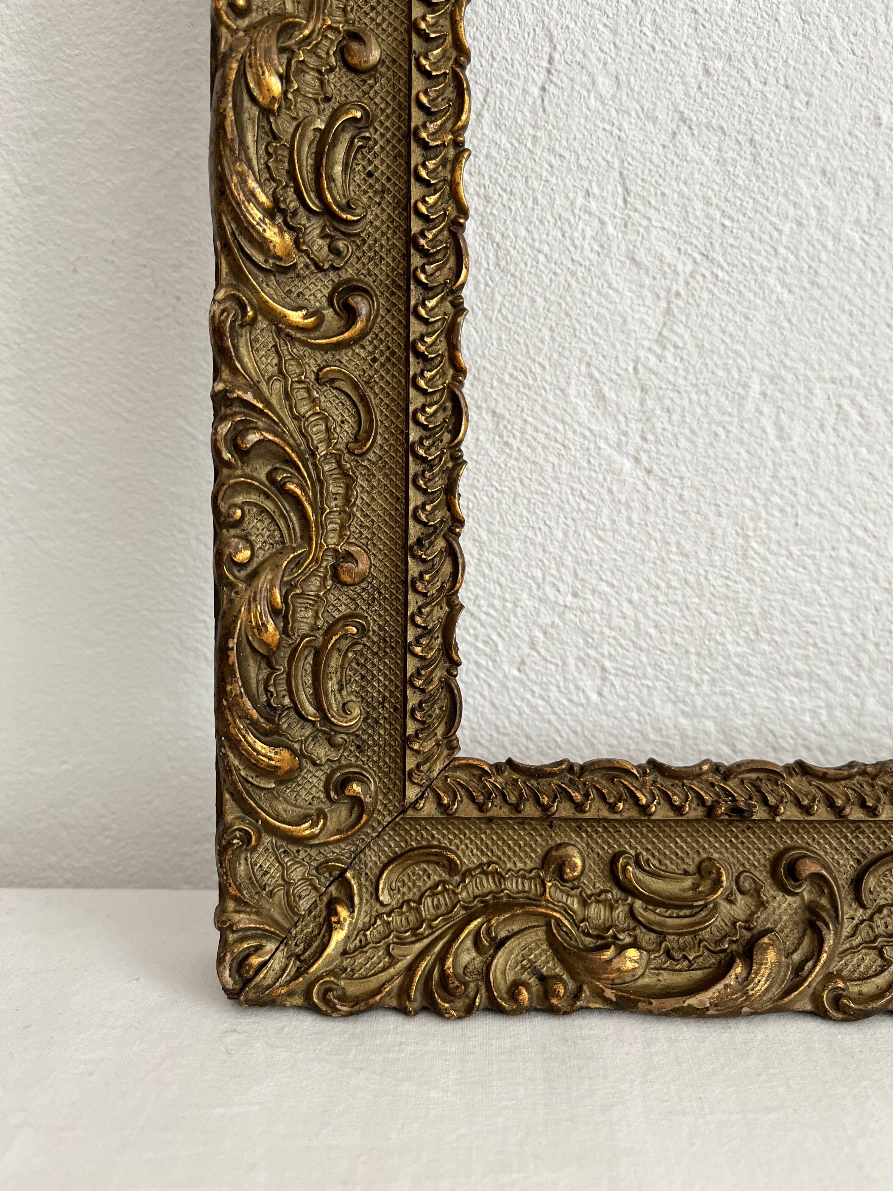 Old frame in gilded wood with stucco decoration circa 1900