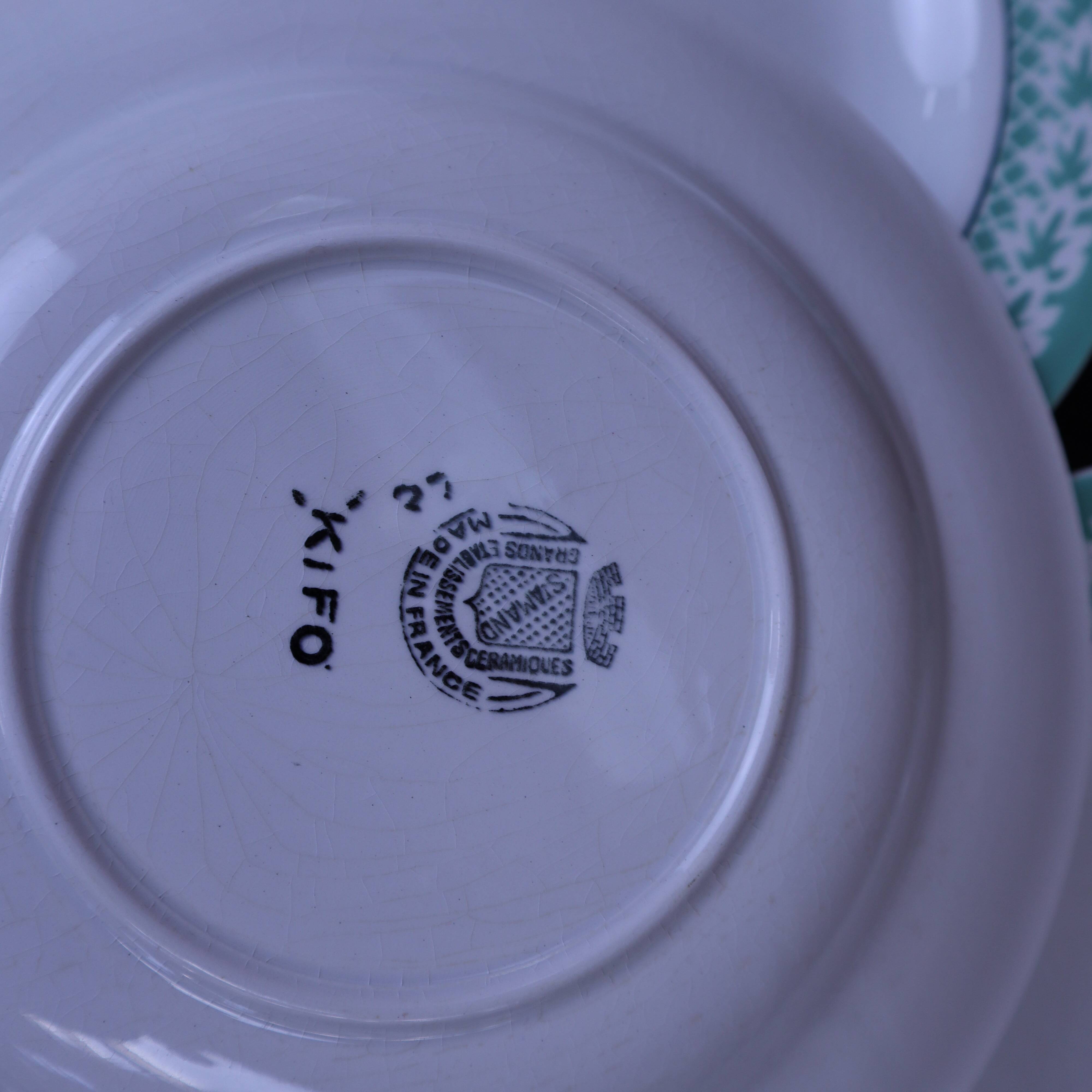 Set of 6 KIFO L'Amandinoise deep plates with green leaf design.