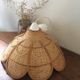 Hanging in wicker and rattan in the shape of a flower