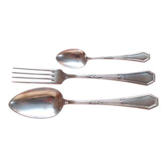tablespoon, fork and small spoon made of silver metal