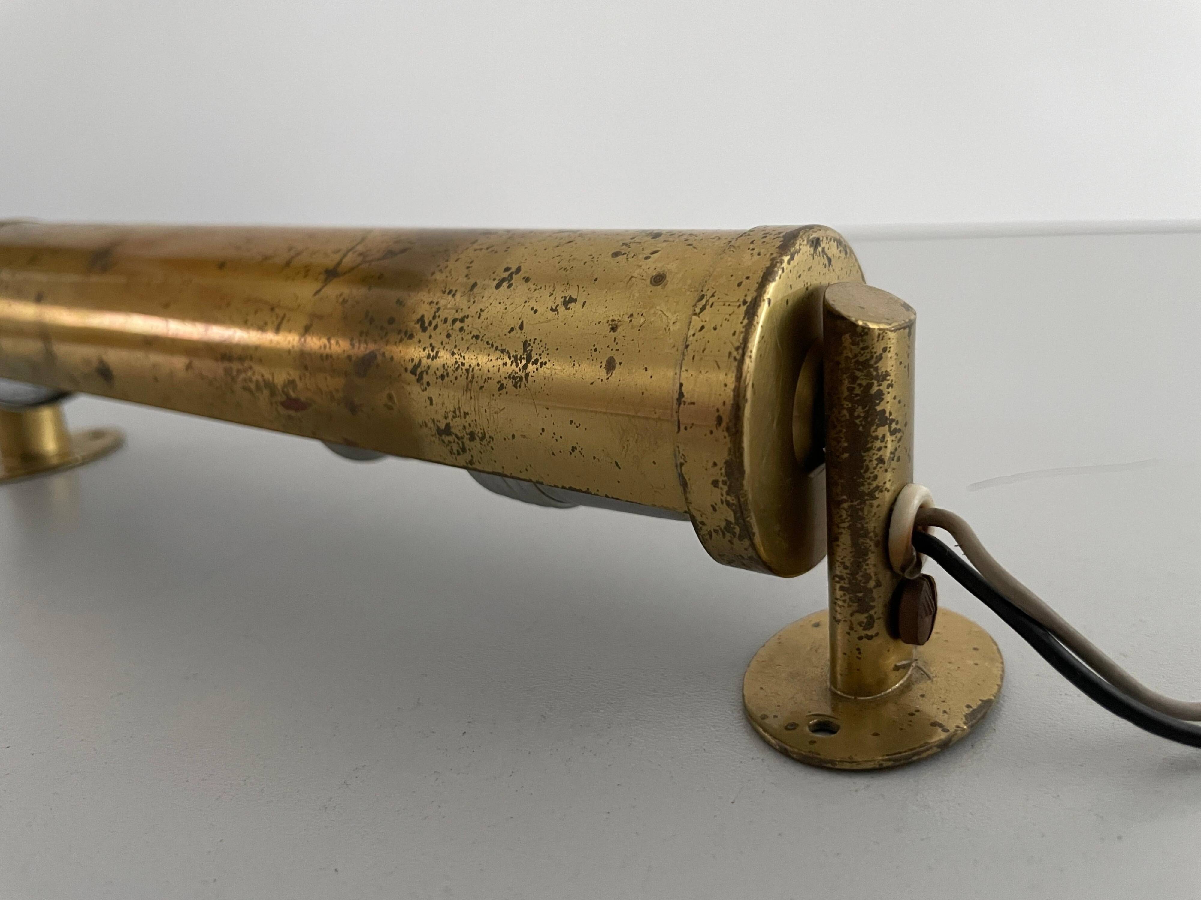 Small simple cylindrical brass wall light from the mid-century, 1950s, Germany.