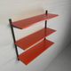 Tomado Holland - A. Dekker wall shelf, orange and black, 1970s