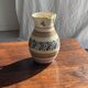 Beige carafe with stylized blue flower friezes