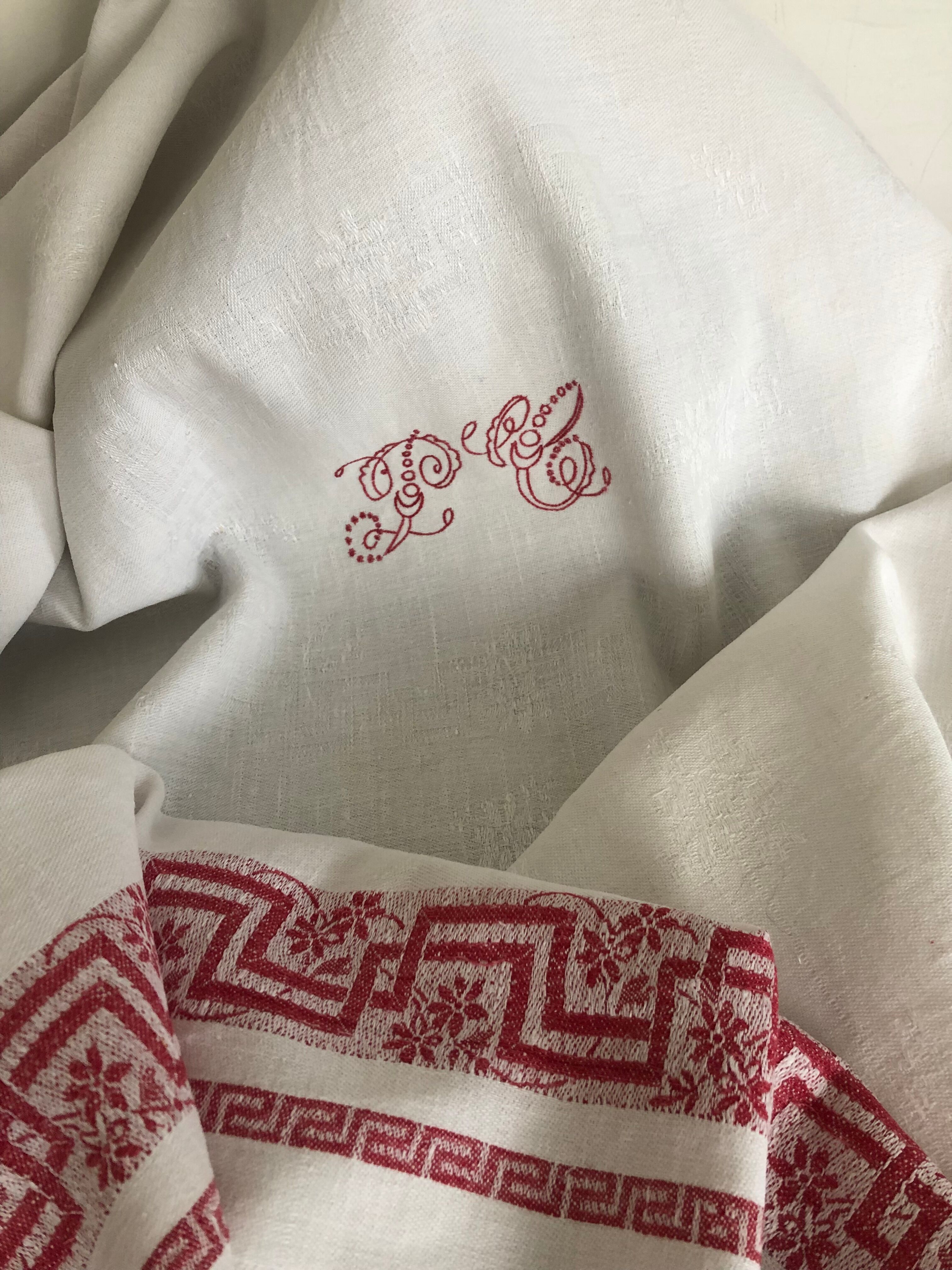Ancient damask tablecloth with monogram