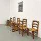 Set of 8 chairs in solid elm with straw seats.