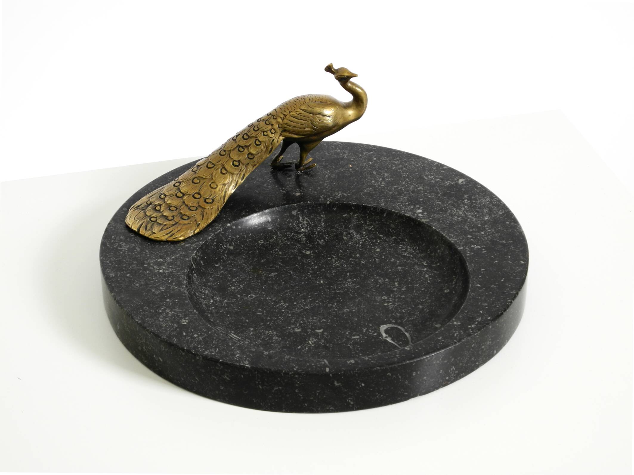 Beautiful, large black granite valet tray featuring a brass peacock, circa