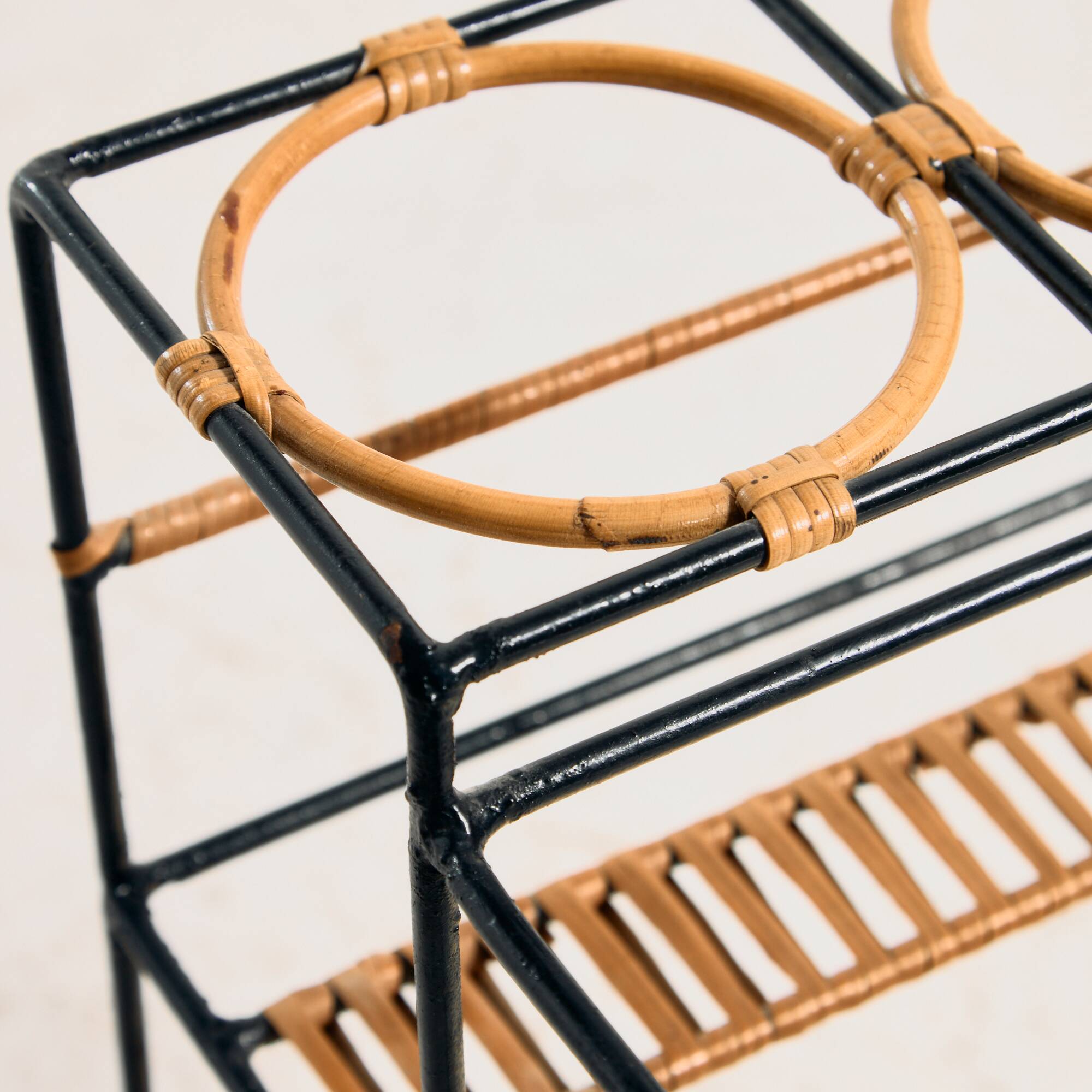 Metal cart with bamboo and wicker details.