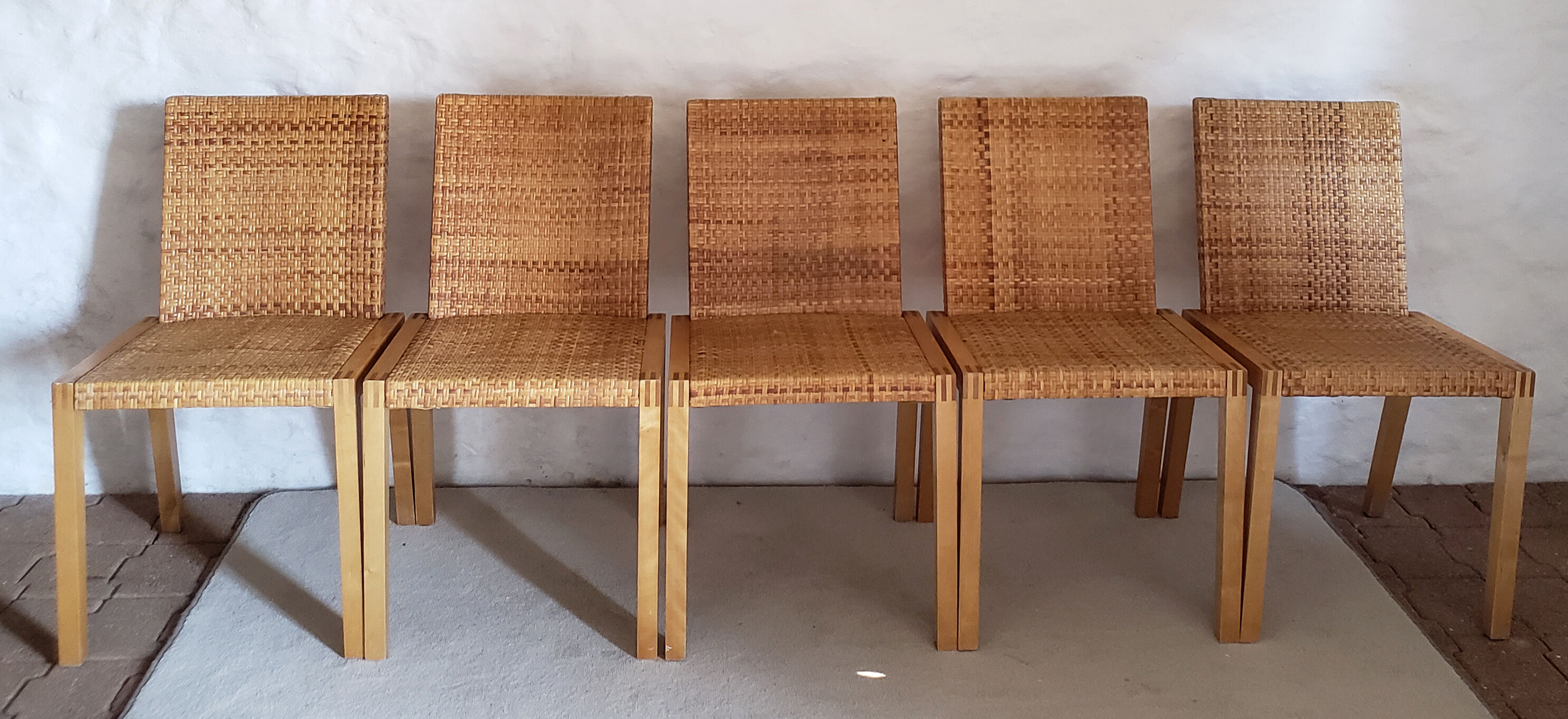 5 wooden and rattan chairs