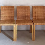 5 wooden and rattan chairs